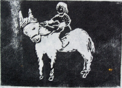 Boy Riding a Pony